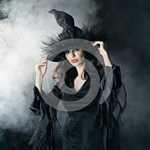 Woman in witch Halloween party costume
