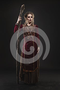 Woman witch with magic pikestaff