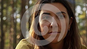 Woman or witch performing magic ritual in forest