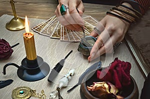 Woman witch prepare a magic potion. Tarot cards. Future reading. Fortune teller concept.