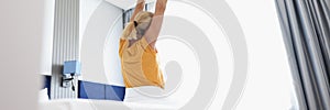 Woman woke up stretching in front of the window, blurry