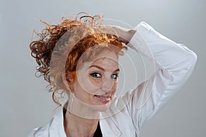 Woman with wonderful curly long red hair