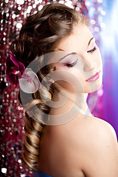 Woman with a wonderful luxury makeup and hairstyle