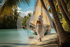 A woman with wooden sailboat as it on the crystal turquoise waters, past beaches fringed with coconut palms and mangroves. A sense