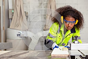 woman work in plywood wood panel modern furniture factory. safety lady worker in wood workshop. african black women young in