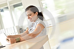 Woman at work using tablet