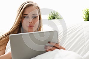 Woman work winh laptop stay in bed early morning