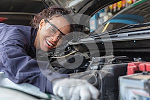 Woman worker at automobile service center, Female in auto mechanic work in garage car technician service check and repair customer