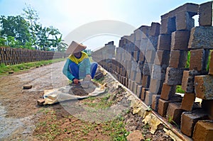 Woman worker in brick factory