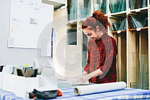 Woman worker packing products for shipment