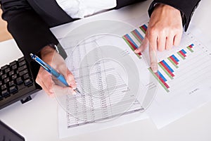 Woman working with bar graphs