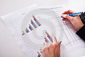 Woman working with bar graphs