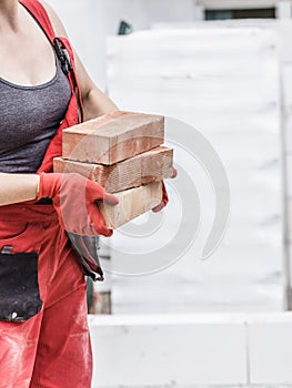 Woman working with bricks