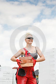 Woman working with bricks