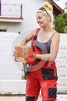 Woman working with bricks