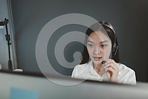 Woman working in call center, young friendly operator woman agent with headsets, Call center agent with headset working on support