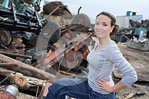 Woman working at car scrapper