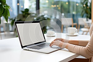 Woman working on computer in modern office, close up. Woman hands typing on keyboard of laptop, online shopping detail