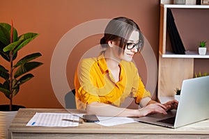 Woman working at the computer in the office