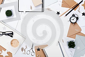 Woman working desk with coffee, office supply, alarm clock and clean notebook top view. Flat lay. Copy space. Mockup frame