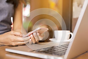 Woman is working She drinks coffee. She uses the phone to communicate.. Concept working women.