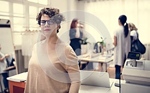 Woman working in fashion retail shop