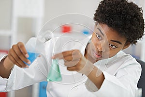 woman working with flask with liquid