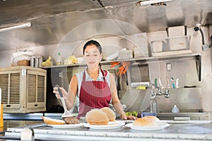 Woman working in a food truck