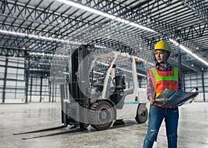Woman working with a forklift in a warehouse