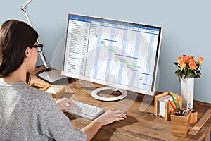 Woman Working On Gantt Chart Using Computer