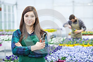 Woman working in green house