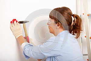 Woman working with hammer