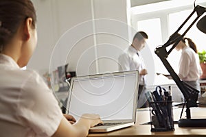 Woman working on her laptop in the office