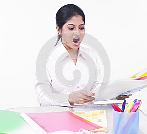 Woman working at her office desk