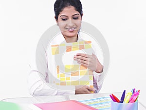 Woman working at her office desk