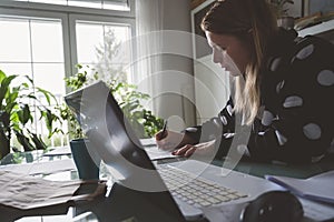 Woman Working at home in bathrobe