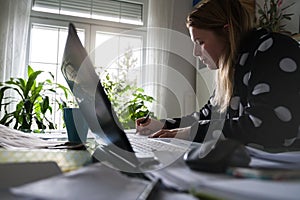 Woman Working at home in bathrobe