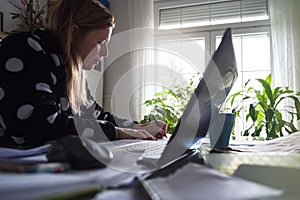 Woman Working at home in bathrobe