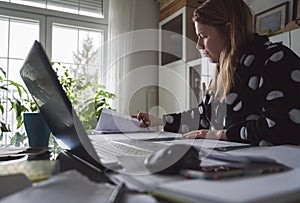 Woman Working at home in bathrobe