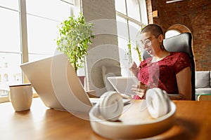 Woman working from home during coronavirus or COVID-19 quarantine, remote office concept