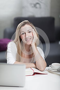 Woman working at home from a home office