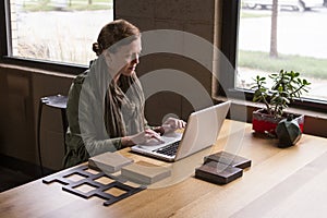 Woman working from home, horizontal
