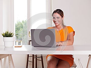 woman working at home with laptop