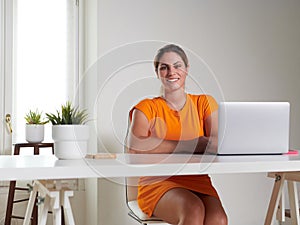 woman working at home with laptop