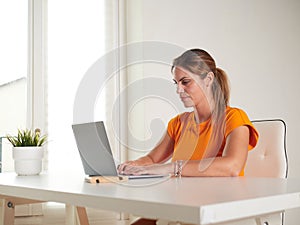 woman working at home with laptop