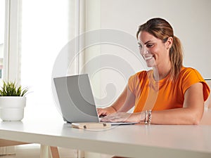 woman working at home with laptop