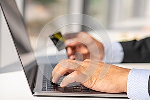 Woman working at home office hand on keyboard close up