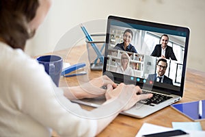 Woman working from home participating in group video call