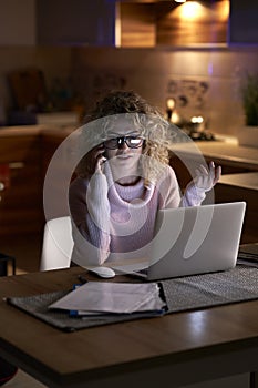Woman working intensively at home photo