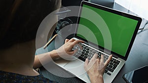 Woman working on laptop computer at office. Female hands typing on laptop keyboard and using touchpad. Business woman doing presen